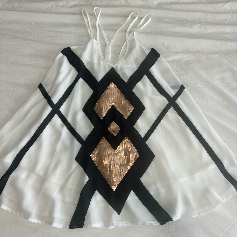 Black, white, and gold sequin dress